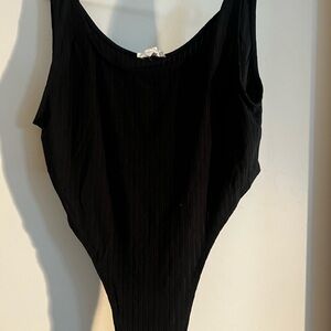 BRAND new plus body suit- never worn